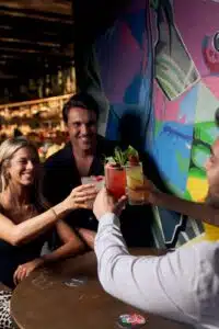 Friends doing cheers at a birthday party